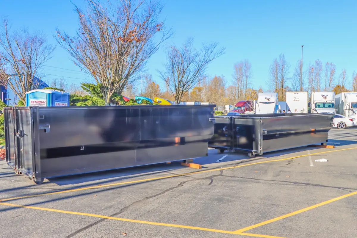 Professional dumpster rental service with roll-off container on residential driveway in Murfreesboro